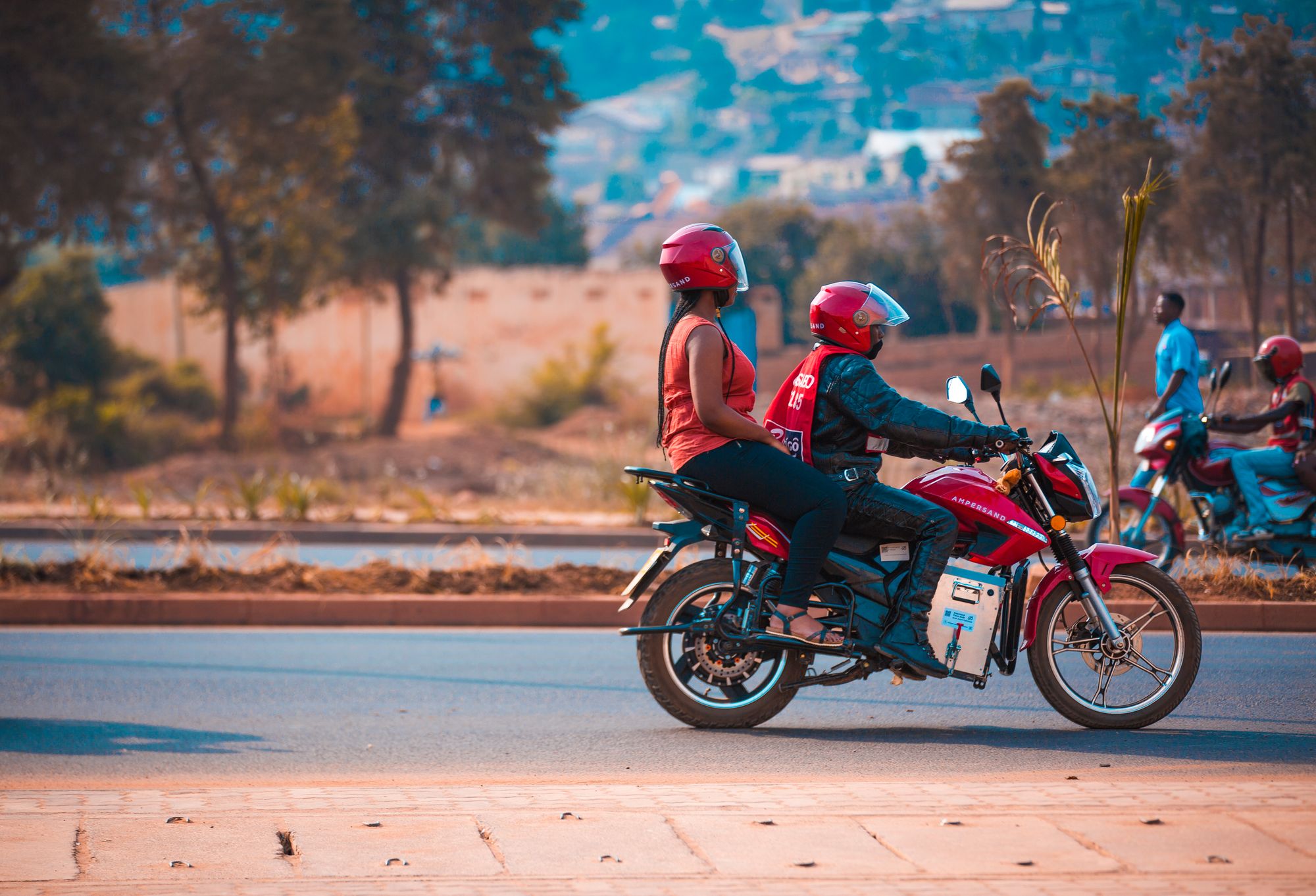 An Ampersand motorcycle in Rwanda, a pilot from ftl