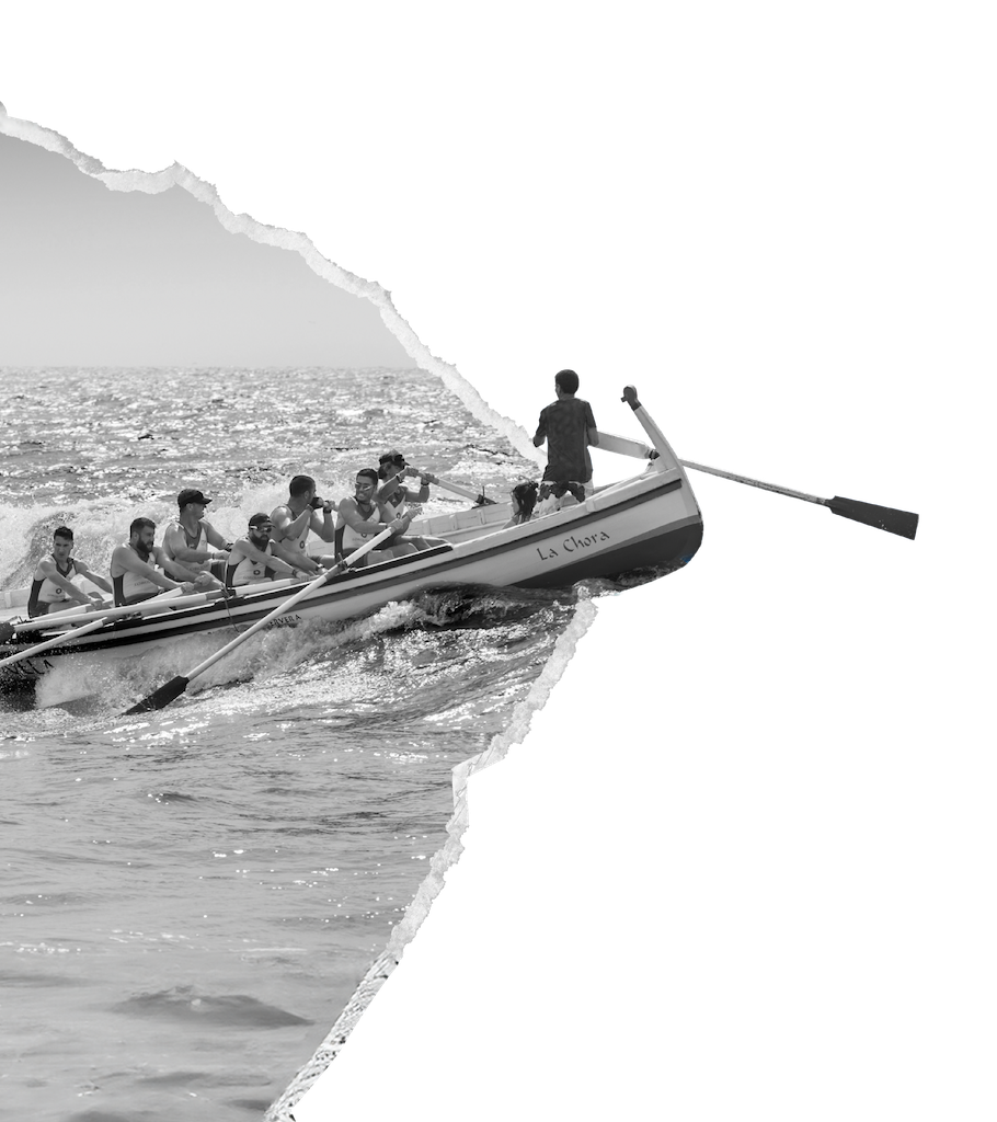 A rowing crew pulling together through choppy water, torn from the page